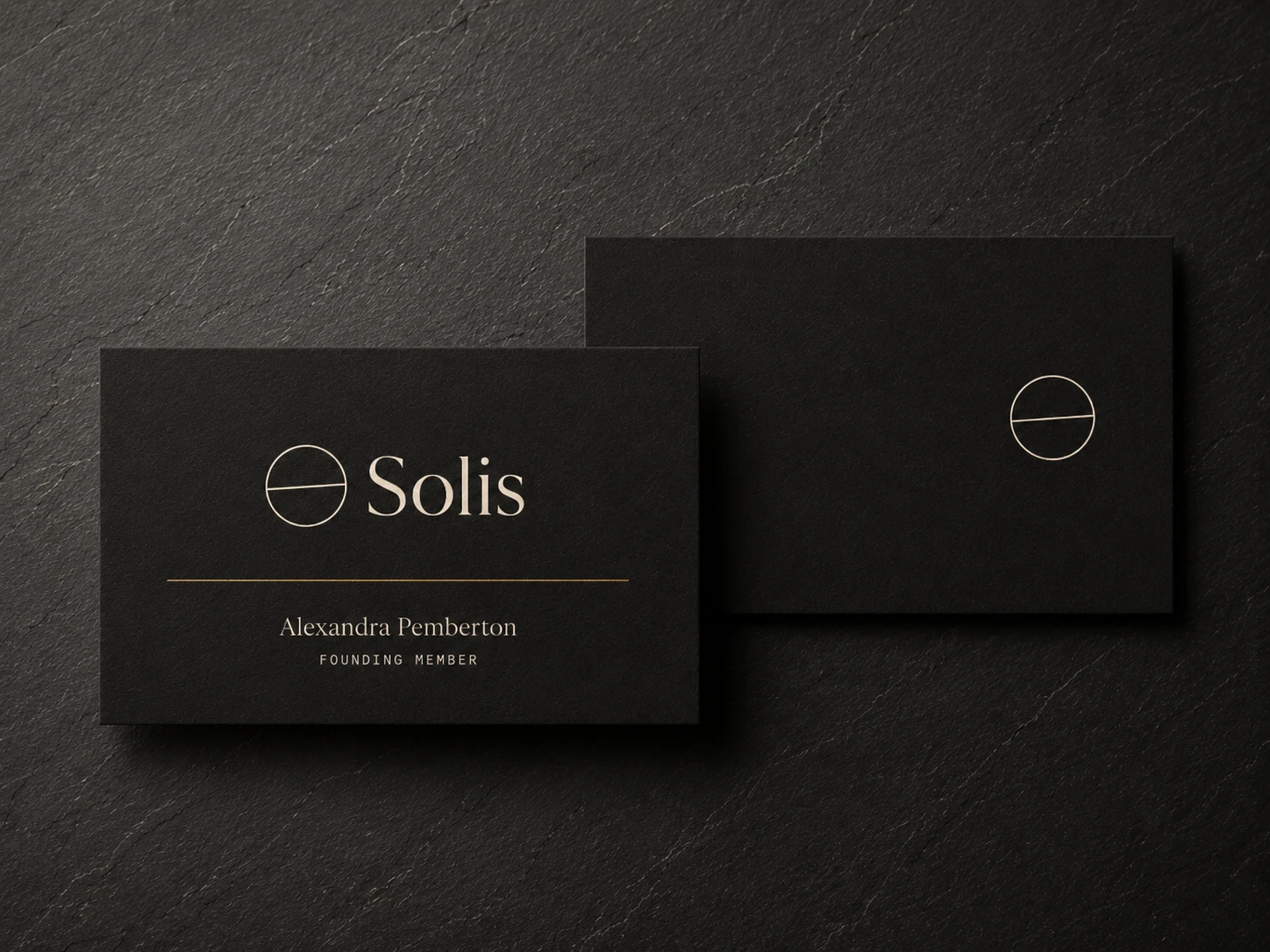 Two Solis membership cards on dark slate: the face with the mark, Solis and Alexandra Pemberton, founding member, and the reverse with the mark alone